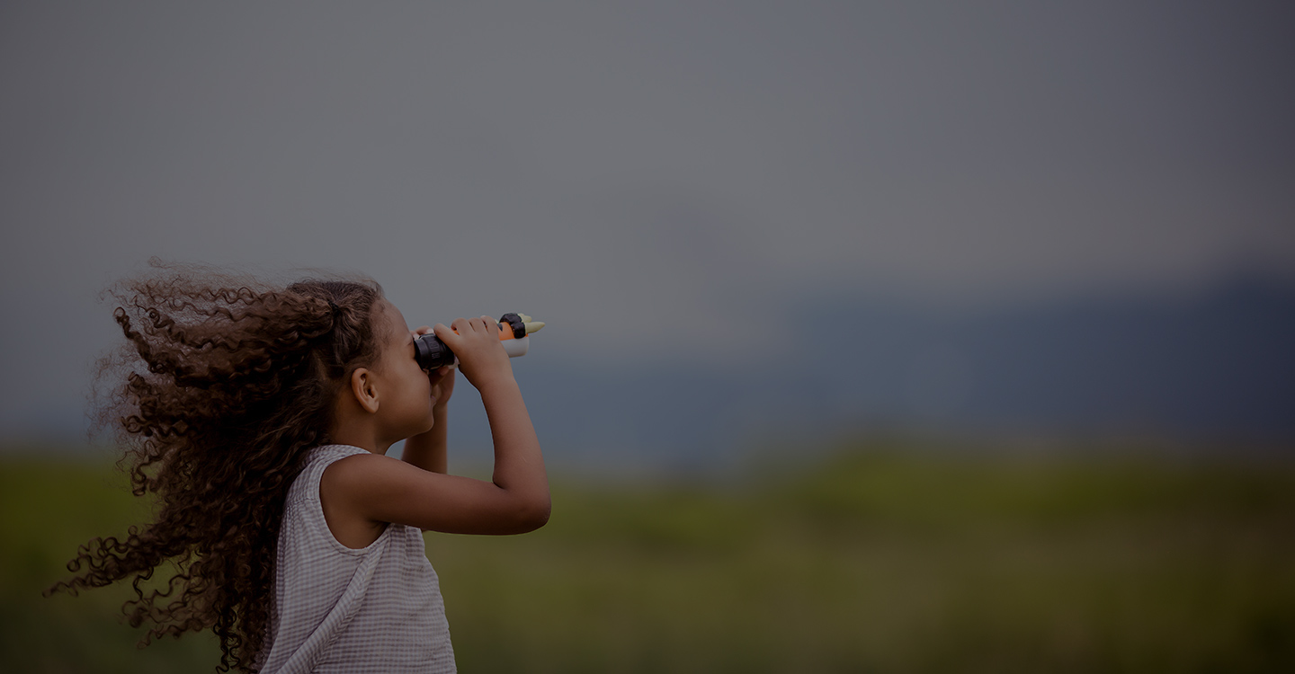 A girl looking through binoculars