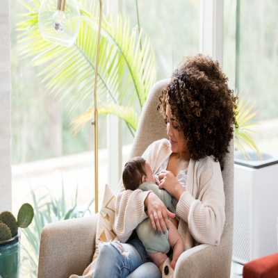 Woman breastfeeding infant